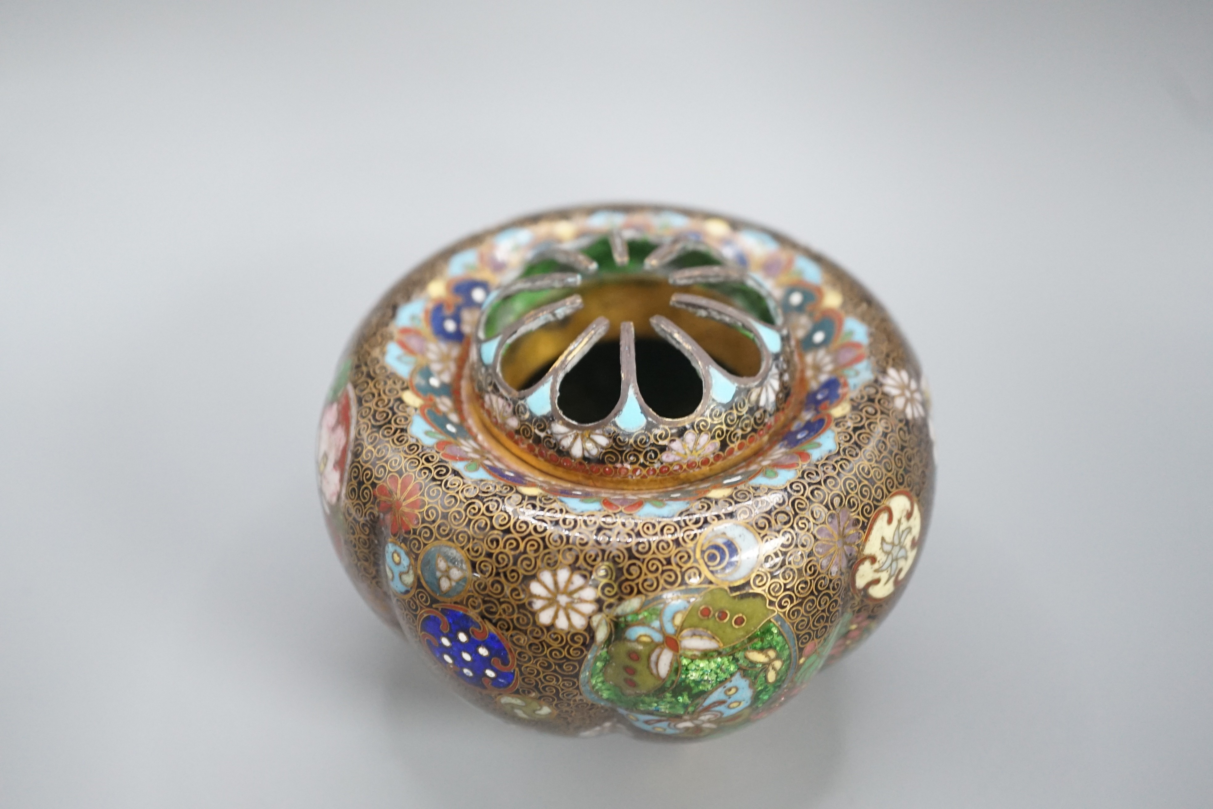A Japanese cloisonne enamel koro and cover, 9.5 cm diameter and various Japanese mixed metal small boxes and covers, One made from Japanese sword fittings, signed, 4 cm